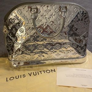 Louis Vuitton Alma Limited Edition Silver Metallic. Purchased 2014 Never carried
